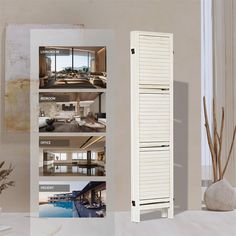 the interior of a room with white walls and wooden shutters