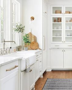 the kitchen is clean and ready to use for us to cook in it's white cabinets