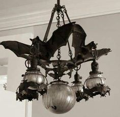 a bat chandelier hanging from the ceiling