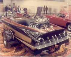 an antique car is on display in a museum