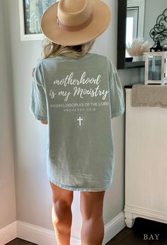 Motherhood Is My Ministry Comfort Colors Shirt The soft-washed, garment-dyed fabric brings an extra coziness to your wardrobe, while the relaxed fit makes it an excellent daily choice. The double-needle stitching throughout the tee makes it highly durable while the lack of side seams helps the shirt retain its tubular shape. - Comfort Colors garment-dyed t-shirt  - A fully customizable tee made 100% with ring-spun cotton. - 100% ring-spun cotton - Medium fabric (6.1 oz/yd² (206.8 g/m - Relaxed f Faith Based Shirts For Women, Christian Mama Shirts, Motherhood Is My Ministry, Womens Christian Shirts, Faith Clothing, Christian T Shirt, Comfort Colors Shirt