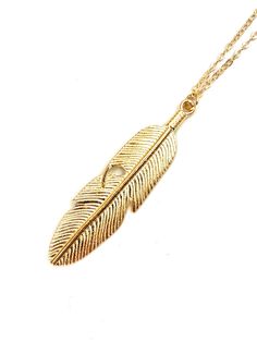 Simple gold color feather pendant. Leaf shaped, long chain, works well on sweaters or cleavage. Dimensions  Feather: 6.1cm height                  1.5cm width  Chain:     70cm  Weight:   10gr Care: Pendants should be removed before washing or showering and should not be worn to swim. Avoid spraying with perfumes or other body sprays or oils and lotions or creams should be dry before putting your jewellery on. Gold Feather Necklace Perfect For Gifting, Gold Feather Necklace For Gift, Gold Necklace With Feathers As A Gift, Gold Necklace With Feathers For Gift, Feather Pendant Necklace, Hippy Gifts, Gold Feathers, Circle Pendant Necklace, Round Necklace