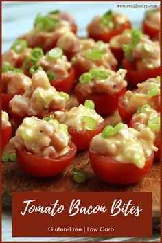 tomatoes stuffed with bacon and green onions are on a cutting board next to the words tomato bacon bites