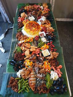 a long table covered in lots of different types of food