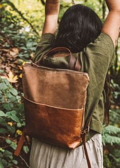 "Introducing our Strathcona Backpack -  made with waxed canvas and paired with our genuine leather, the Strathcona makes the perfect lightweight bag, great for the everyday essentials. The Japanese printed accent pieces on the front doubles as a deep pocket and it also features a zipper closure and adjustable leather straps. * Made from American made tan waxed canvas * Front pocket in rusty brown cowhide leather * Brown cowhide adjustable backpack straps * Thick natural off-white canvas lining with one inner pocket * Measures 13.5\" across x 12\" in height to 3\" gusset * Brass YKK metal zipper and leather zipper pull * Handle on top with a 3\" drop Waxed canvas is a durable, weather resistant material that can be wiped clean. This material has a softness with natural creases that will var Leather Diaper Bag Backpack, Stylish Laptop Bag, Hipster Backpack, Stylish Diaper Bag, Waxed Canvas Backpack, Waxed Canvas Bag, Brown Leather Backpack, Utility Bag, Women Leather Backpack