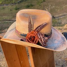 Take on the wild west in style with our Blessed Hand Painted Hat. Made from premium straw, this small-sized cowboy hat is a statement piece. Hand painted flowers and vintage details, accented with metal feathers, add a unique touch. Painted Hats, Vintage Details, The Wild West, Hand Painted Flowers, Painted Flowers, Little Birds, Cowboy Hat, Custom Hats, Wild West