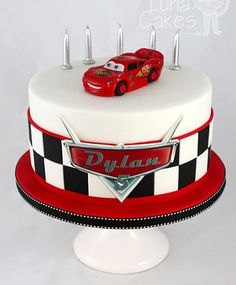 a birthday cake with cars on top