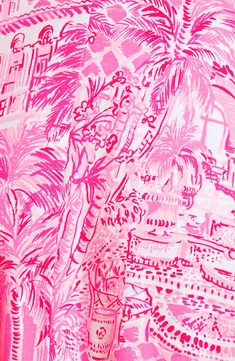 a pink and white wallpaper with palm trees on the left hand side is shown