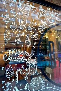 the window is decorated with christmas doodles