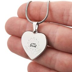 Surprise your loved one by giving them this sweet Engraved Heart Necklace! It's a classic and heartfelt jewelry piece that is sure be treasured. If the custom engraving option is available, you can choose to personalize onto the back of the pendant your loved one's name, a special date, or anything else you want to remember and keep you close to their heart. Each personalized piece offers exceptional craftsmanship that is fit to be an instant classic in your family.The Engraved Heart Necklace is attached to an adjustable snake chain, and made from high quality stainless steel, and is also available in an 18K yellow gold finish option. Product Specifications: Pendant size 0.9" x 0.94" (2.3cm x 2.4cm) 18"-22" Adjustable snake chain Lobster clasp attachment Polished stainless steel or 18K yel I Am Present, Engraved Heart Necklace, I Am Loved, Pearl Love, Box Making, Message Jewelry, Love Affirmations, A Snake, Polished Stainless Steel