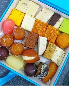 a blue box filled with different types of food