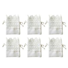 six pieces of white fabric with lace on them