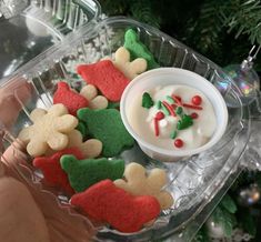 two pictures showing different types of cookies in plastic containers and one with frosting on it