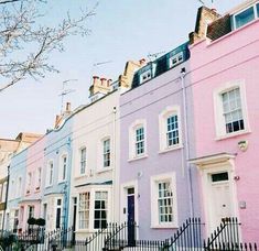 row of pastel colored houses in london