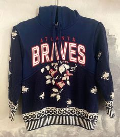 Atlanta Braves hoodie spliced with a darling floral sweater. Make a statement with this one of a kind piece. Both original pieces were a size small. Sweater is hand knit cotton. Message me with any questions! *GrandmasGarbo is not affiliated, sponsored, endorsed, and/or licensed by the NFL, MLB, NHL, NBA, NCAA, or any college and/or professional sports team/league. Sporty Patchwork Sweater For Winter, Vintage Long Sleeve Hoodie For Spring, Vintage Winter Tops With Drawstring Hood, Vintage Hooded Tops For Winter, Vintage Hooded Winter Sweater, Braves Game Outfit, Braves Game, Floral Sweater, Small Sweater