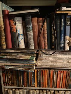 an old book shelf with many books on it