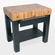 a black table with a butcher block on top