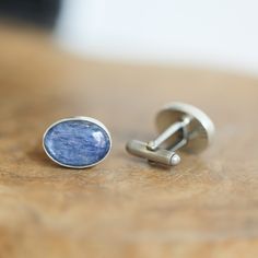 Blue Kyanite Cufflinks - Ready to Ship - You will receive the beautiful pair of Blue Kyanite Cufflinks in the photos Cufflinks or Cuff Links? Either way, we have opted for .925 Sterling Silver cuff link hardware and a minimal design to highlight these wonderful, natural deep blue kyanite Oval cuff links. These Silversmithed cufflinks offer the wearer the gorgeous, unique steely blue only found in high-grade natural Kyanite. This pair is for a true lover of cuff links and will quickly become a fa Polished Cuff Jewelry For Gifts, Business Sterling Silver Jewelry With Polished Finish, Classic Blue Jewelry For Business, Classic Blue Cufflinks With Polished Finish, Oval Polished Finish Cufflinks For Gift, Silver Oval Cufflinks Gift, Oval Polished Cufflinks For Gift, Silver Oval Cufflinks For Gift, Silver Oval Cufflinks As Gift