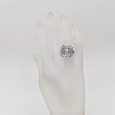 Beautiful 22.65 ct. pink kunzite emerald cut with 0.51 ct. good quality white diamond rounds.  Handmade in 18k white gold.  Ring size 7.5.  Metal:White Gold Stone: White Diamond,Kunzite Stone Cut: Emerald Cut  Dimensions reference the ring size and are not specific to the ring itself. Exact ring dimensions are not provided. Please reach in the seller Q&A for questions. Luxury Pink Amethyst Ring With Prong Setting, Formal Pink Amethyst Ring With Prong Setting, Pink Baguette Cut Diamond Ring For Formal Events, Luxury Pink Amethyst Ring For Formal Occasions, Formal Pink Amethyst Ring, Pink Amethyst Ring In Sterling Silver For Formal Occasions, Elegant Pink Kunzite Rings, Formal Kunzite Ring With Prong Setting, Formal Kunzite Jewelry With Prong Setting