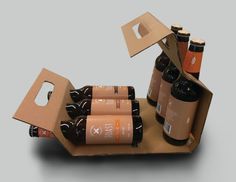 an open cardboard box with six bottles in it and one opened on the other side