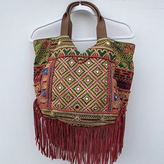 Lauren' Fringe Hobo Bag In Warm Multidecked Out In Colorful Fringe And A Patchwork Of Luxe Textures, This Globe-Trotting Hobo Goes Anywhere In Style. By Sam Edelman. Large Sized Bag; 14"W X 12"H X 4-1/2"D Interior Features 1 Zip Pocket And 2 Slip Pockets 7-1/2"L Double Handles Top Zip Closure Exterior Features Gold-Tone Hardware And Hanging Fringe Silhouette Is Based Off 5'9" Model Cotton; Trim: Leather; Fringe: Suede. Please Look At The Last Picture For The Minor Scratches Fringe Handbags, Crochet Weaves, Vegan Leather Tote, Braids With Weave, Trending Handbag, Leather Hobo Bag, Leather Fringe, Black Purses, Yellow Fashion