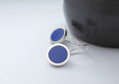 "Simple modern round drop earrings in sapphire blue resin and Sterling Silver. Clean-lined and lightweight to wear they are make a great everyday pair of earrings. > 1.2 cm diameter x 2.5 cm long drop > Recycled Sterling Silver and resin > Made to order  > Posted by registered mail Made with great attention to detail, I have added a security hook so they don't get lost in scarves and woolly jumpers. My modern earrings have a crisp edged frame and simple styling and are filled with lightweight, s Nickel-free Blue Circular Earrings, Nickel-free Blue Earrings, Blue Nickel-free Round Earrings, Minimalist Blue Earrings With Ear Wire, Modern Blue Sterling Silver Earrings, Everyday Blue Circular Earrings, Everyday Blue Circle Earrings, Modern Blue Earrings For Everyday, Modern Blue Earrings For Everyday Wear