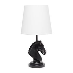 a black horse head lamp with a white shade