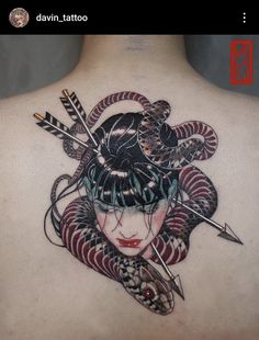 the back of a woman's body with tattoos on her chest and arrows in her hair