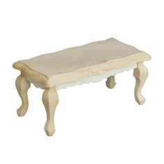 a small wooden bench sitting on top of a white floor