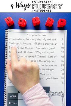 a hand is pointing at red dices on top of a book with the title 9 ways to increase flueny in students