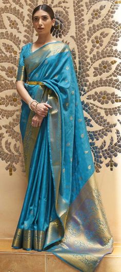 Cost Includes Saree,Unstitched BlouseFall & Edging Work Description: Blue color Saree in Kanchipuram Silk, Silk fabric with Weaving work Fabric: Kanchipuram Silk, Silk Work: Weaving Color Family: Blue Style: South Occasion: Traditional Saree Dimension: 530 Cm x 110 Cm ( L x W) Blouse Length: 80 Cm Approx Washing Instruction: Dry Wash Blue Festive Slub Silk Traditional Wear, Blue Slub Silk Traditional Wear For Festive Occasions, Festive Blue Slub Silk Traditional Wear, Blue Cotton Silk Traditional Wear For Festive Season, Blue Slub Silk Traditional Bollywood Wear, Blue Cotton Silk Kurta With Pallu, Transitional Blue Blouse With Zari Work, Blue Cutdana Traditional Wear For Eid, Blue Cutdana Kurta For Festivals