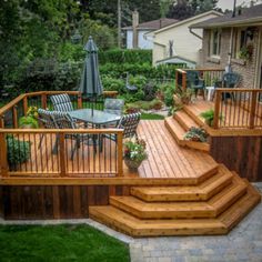 a wooden deck with patio furniture and an umbrella