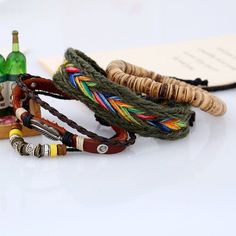 With its own rustic handmade patterns and silky natural wooden beads, this Boho Feather Charm Beaded Multilayer Bracelet exudes real hippy vibes. This bright accessory is a beautiful conversation piece, with a handwoven rainbow design, silver feather charm, and vivid hand-strung beads. Specs: Material: Leather, cotton cord, Zinc Alloy unisex adjustable: 18cm to 23.5cm 3Pcs/Set Bohemian Multicolor Hand Wrapped Braided Bracelets, Brown Bohemian Braided Bracelet, Brown Bohemian Braided Bracelets, Handmade Brown Braided Bohemian Bracelets, Handmade Brown Bohemian Braided Bracelets, Handmade Brown Bohemian Braided Bracelet, Handmade Bohemian Brown Braided Bracelets, Bohemian Brown Woven Braided Bracelets, Handmade Brown Braided Bracelets For Festival