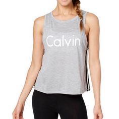 Cropped Tank From Calvin Klein Performance With Racer-Stripe. Dropped Armholes, Cropped Shape, Hits Above Waist, Drop Arm Openings, Stripes At Sides; Polyester/Rayon Machine Washable Fitted Trendy Calvin Klein Tops, Trendy Fitted Calvin Klein Tops, Stretch Cotton Calvin Klein Tops, Calvin Klein Stretch Cotton Tops, Cotton Workout Tops With Three Stripes, Fitted Calvin Klein Athleisure Tops, Casual Stretch Calvin Klein Tank Top, Calvin Klein Sporty Stretch Top, Sporty Calvin Klein Tops For Sports