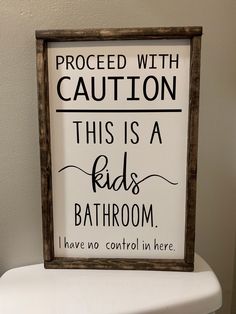 a bathroom sign that says proceed with caution this is a kids bathroom have no control in here