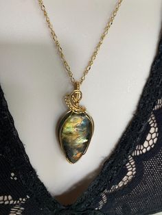 Brilliant flashes of,  copper, gold, green, blue, purple, and, pink on this beautiful labradorite gemstone.  2" long (without the bail)  labradorite gemstone wire wrapped with brass wire. To keep the new brass look, clean with brass cleaner or dip in jewelry cleaning solution when needed. Brass Cleaner, Jewelry Cleaning, Jewelry Cleaning Solution, Green Blue Purple, Labradorite Jewelry, Labradorite Necklaces, Healing Jewelry, Buffalo Ny, Labradorite Pendant