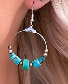 Turquoise hoop earrings in sterling silver. These turquoise bead earrings feature hand carved turquoise stone beads as well as sterling silver beads making these round drop earrings very special! These turquoise earrings have a boho feeling and also make a fine addition to your Western jewelry collection. This turquoise is top quality and makes a stunning compliment to your favorite outfit. Because these are natural turquoise stones, there is slight variations in each stone, which adds to the be Artisan Turquoise Jewelry With Matching Earrings, Turquoise Jewelry With Matching Earrings, Handmade Blue Hoop Jewelry, Beaded Circle Jewelry For Gifts, Beaded Circular Jewelry Gift, Blue Small Hoop Earrings With Matching Set, Blue Small Hoop Earrings, Blue Small Hoop Jewelry, Artisan Turquoise Sterling Silver Jewelry