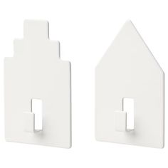 two white house shaped wall plates with one light switch and the other is facing each other