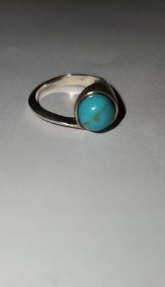 Estate Sterling Silver Ring featuring Gorgeous Turquoise Stone in a Modern Minimalist Setting. Size:  6 Modernist Turquoise Jewelry Gift, Modern Turquoise Ring As Gift, Modern Turquoise Ring For Gift, Modern Turquoise Ring For A Gift, Minimalist Turquoise Open Ring Jewelry, Minimalist Turquoise Ring For Everyday, Minimalist Round Turquoise Jewelry, Minimalist Turquoise Round Jewelry, Minimalist Open Turquoise Ring