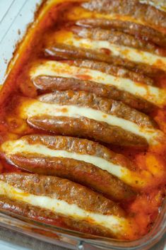 a casserole dish with sausages and cheese in the bottom, ready to be eaten