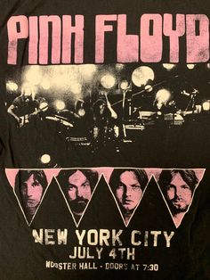 a black shirt with pink print on the front and back of it that says, new york city