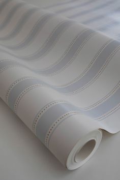 an image of a white wallpaper with wavy lines on the paper and it's edge