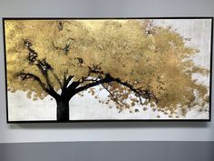 a painting on the wall of a tree with yellow leaves