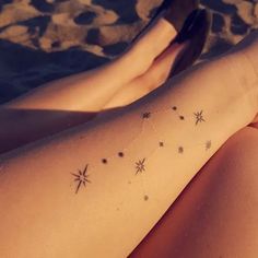 a woman's leg with stars on it