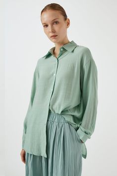 Sydney Back Open Shirt Button down style. Sheer, oversized shirt with open back detail. Professional Clean Only / Do Not Tumble Dry Model's height is 5′ 7″ (157cm) Bust 31in Waist 23in Hip 34in and wearing S/M Oversized Tops With Spread Collar In Solid Color, Relaxed Fit Shirt With Button Cuffs For Day Out, Spring Shirt With Relaxed Fit And Shirttail Hem, Relaxed Fit Shirt With Shirttail Hem For Spring, Effortless Shirt With Shirttail Hem For Day Out, Effortless Long Sleeve Shirt For Day Out, Effortless Spring Shirt With Shirttail Hem, Effortless Shirt With Shirttail Hem For Spring, Spring Daywear Shirt With Shirttail Hem