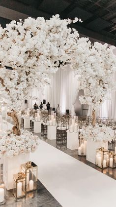 an elegant wedding setup with white flowers and candles