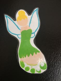 an image of a sticker with a little fairy on it's back side