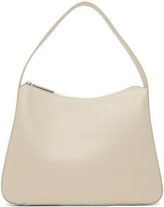 Buffed leather shoulder bag in beige. · Fixed shoulder strap · Zip closure · Zip pocket at interior · Cotton herringbone lining · H9.5 x W12.5 x D3 in Supplier color: Oyster white Nothing Written, Buy Nothing, Oyster White, Beige Bag, Luxury Streetwear, White Leather, Herringbone, Leather Shoulder Bag, Designer Fashion