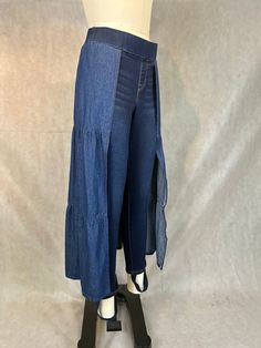 "Gender Inclusive Upcycled \"Skants\" - A Mash Up of Pull On Stretch Denim Jeans and a Denim Prairie Skirt - A Look For All! Size Women's 4 Pull On Stretch Denim Jeans 98% Cotton, 2 % Spandex Women's Lightweight Denim Prairie Skirt Waistband: 30\"-34\" Hips: 38\"-44\" Inseam: 26\" Front Rise: 10.5\" Back Rise: 16\" Length from waist to skirt hem: 34\" Stirrups" Fitted Cotton Bottoms For Layering, Cotton Bottoms For Layering In Spring, Spring Layering Cotton Bottoms, Stretch Lagenlook Bottoms For Spring, Spring Lagenlook Stretch Bottoms, Indigo High Waist Fitted Bottoms, Fitted High Waist Indigo Bottoms, Fitted Indigo Bottoms For Spring, Fitted Indigo Denim Bottoms