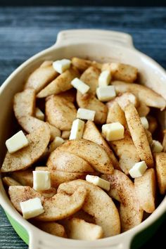 apple slices and cubes in a bowl on a table